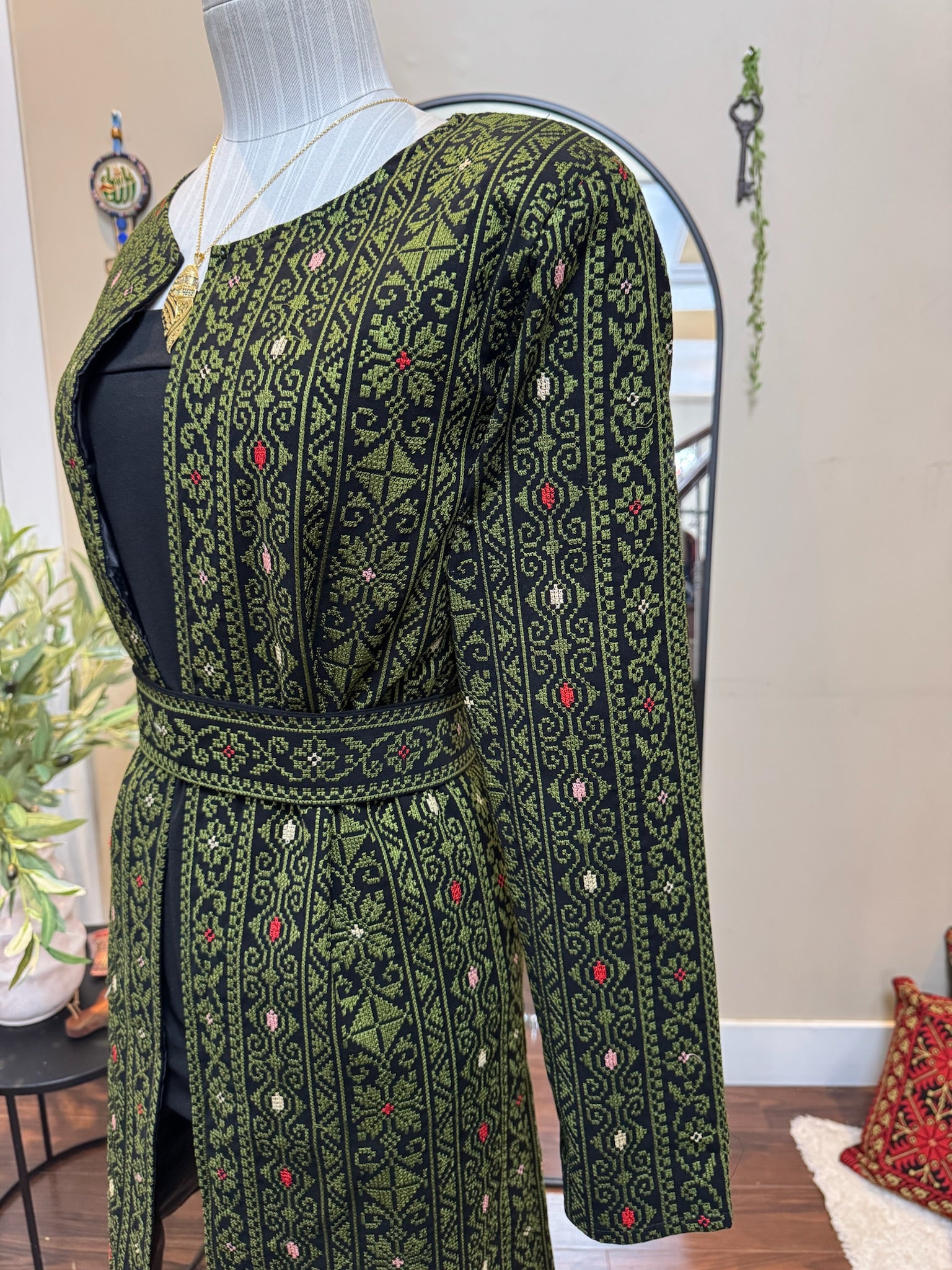 Green Palestinian embroidery blazer with belt .