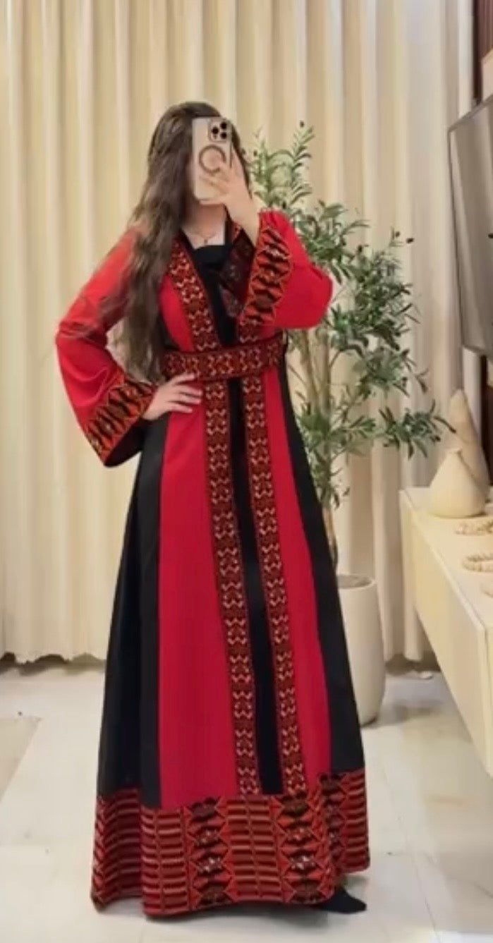* Poppy Thobe ثوب شقائق النعمان
A graceful Palestinian-inspired thobe crafted in striking crimson and black, featuring authentic embroidered details, elegant long sleeves, and a flattering silhouette that blends timeless tradition with refined style.